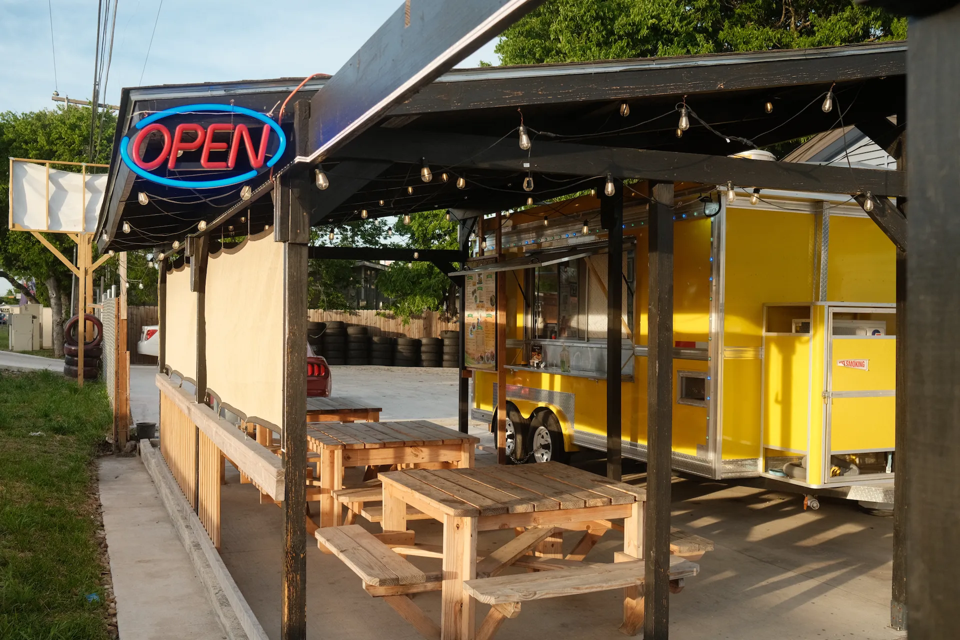 open sign on a covered food truck