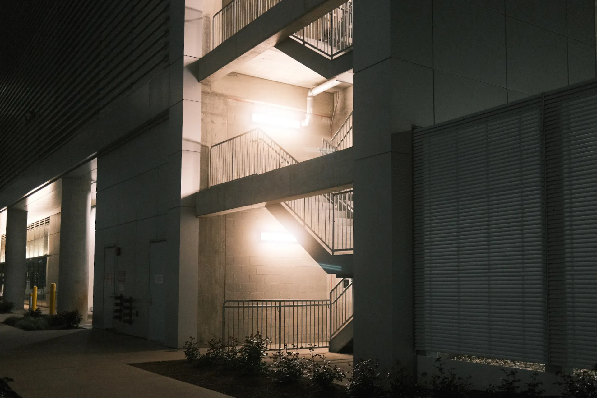 A parking garage stairwell at night